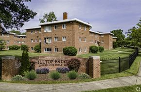 Cleveland apartment for rent - a large brick building with a black fence in front of it