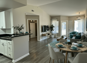 Naples apartment for rent - A modern kitchen with a dining table set for four at Aqua Bay Apartments in Naples, FL 34116