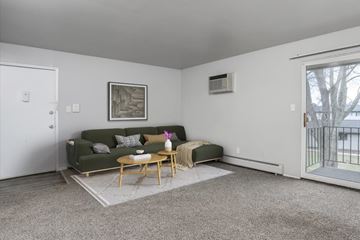 Westland apartment for rent - A living room with a green couch and a coffee table.