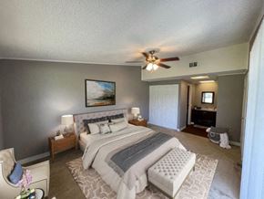 Lake Mary apartment for rent - a bedroom with a bed and a ceiling fan