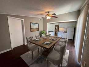 Lake Mary apartment for rent - a dining room with a table and chairs and a ceiling fan