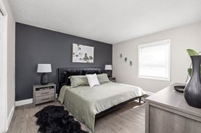 Indianapolis apartment for rent - a bedroom with a bed and a dresser