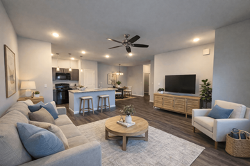 Louisville apartment for rent - A living room with a grey couch and a wooden coffee table.