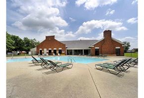Indianapolis apartment for rent - Outdoor pool area with several lounge chairs surrounding the pool. 