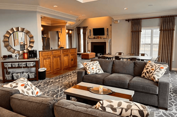 Brownstown apartment for rent - A living room with a grey couch and a coffee table.