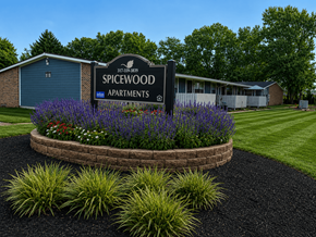 Indianapolis apartment for rent - A Spicewood Apartments sign is displayed in front of a building.