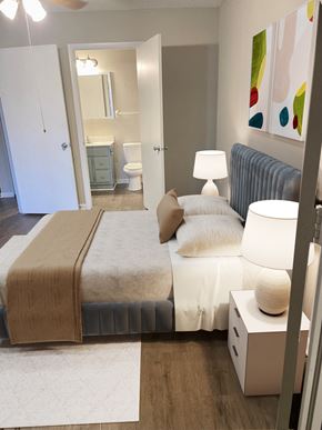 Naples apartment for rent - a bedroom with a bed and a bathroom at Aqua Bay Apartments in Naples, FL 34116