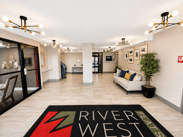 Indianapolis apartment for rent - A living room with a rug that says River West.