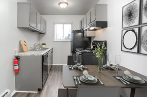 Westland apartment for rent - A modern kitchen with a dining table set for two.