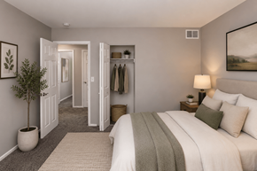 Indianapolis apartment for rent - A bedroom with a large bed and a closet.