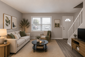 Indianapolis apartment for rent - A living room with a couch, coffee table, and a television.