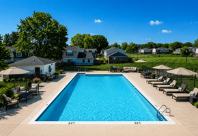 Indianapolis apartment for rent - A large swimming pool surrounded by lounge chairs and umbrellas.