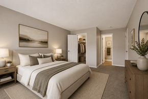 Indianapolis apartment for rent - A well-lit bedroom with a large bed and a painting on the wall.