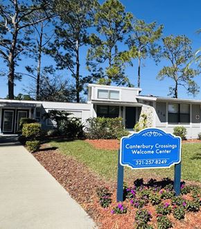 Lake Mary apartment for rent - A Canterbury Crossings Welcome Center sign in front of a building.