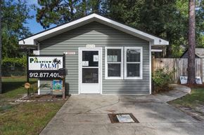 Hinesville apartment for rent - a small gray building with a sign that says pavement palm
