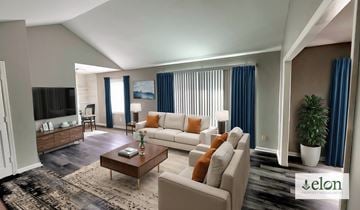 Indianapoils apartment for rent - A living room with a white couch and a coffee table.