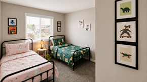 Indianapolis apartment for rent - A bedroom with two beds and a wall of framed pictures.