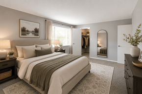 Indianapolis apartment for rent - A bedroom with a large bed and a painting on the wall.