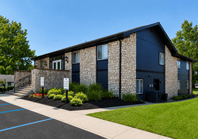Indianapolis apartment for rent - A building with a stone facade and dark blue trim.