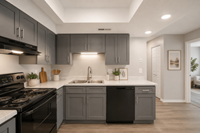 Indianapolis apartment for rent - A modern kitchen with dark grey cabinets and white countertops.