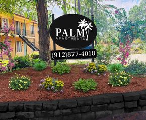 Hinesville apartment for rent - a picture of a garden with a sign that says palm apartments