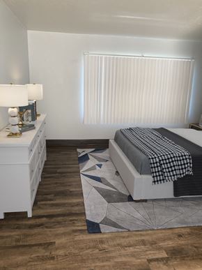 Cleveland apartment for rent - a bedroom with a bed and a dresser