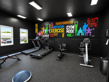 Indianapolis apartment for rent - A gym with a variety of equipment and motivational wall decals.