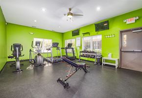 Fairfield apartment for rent - A gym with a variety of equipment including treadmills, stationary bikes, and weight machines.