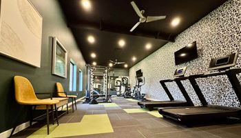 A gym with a treadmill