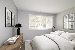 Indianapolis apartment for rent - a white bedroom with a large bed and a window