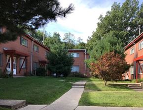 Cleveland townhouse for rent - a sidewalk in front of some houses