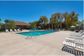 Fairfield apartment for rent - A pool surrounded by chairs and trees.