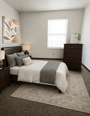 Lucasville apartment for rent - A bedroom with a bed, nightstand, and dresser.
