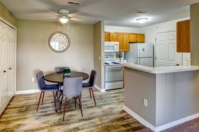 Brownstown apartment for rent - A kitchen with a table and chairs in the middle of the room.