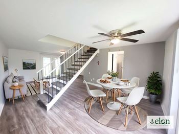 A dining room with a table set for four