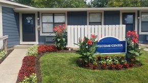Indianapolis apartment for rent - a blue and white sign in front of a house