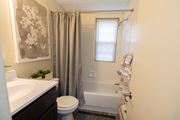 Baltimore apartment for rent - Bathroom with a shower, toilet and sink  at Loch Bend Apartments, Baltimore, MD, 21234.