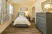 Edgewood apartment for rent - Bedroom with a bed and dresser in a 555 waverly unit at Seven Oaks Townhomes, Edgewood