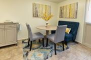 Baltimore apartment for rent - A dining room with a round table and grey chairs  at Winston Apartments, Baltimore, Maryland