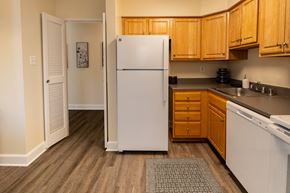 Owings Mills apartment for rent - A kitchen with white appliances at Painters Mill Apartments, Owings Mills, MD, 21117