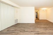 Lutherville-Timonium apartment for rent - Living room with a wood floor and white walls at Seminary Roundtop Apartments, Lutherville