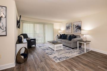 Towson apartment for rent - Living room with furniture and balcony door