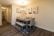 Baltimore apartment for rent - Dining room with a dining table and chairs and a wall with artwork at Village of Pine Run Apartments & Townhomes*, Maryland, 21244