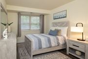 Baltimore apartment for rent - Second bedroom with bed, nightstand and window at Village of Pine Run Apartments & Townhomes*, Maryland, 21244