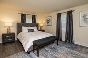 Baltimore apartment for rent - A bedroom with bed and windows at Spring Hill Apartments & Townhomes, Baltimore, MD 21234