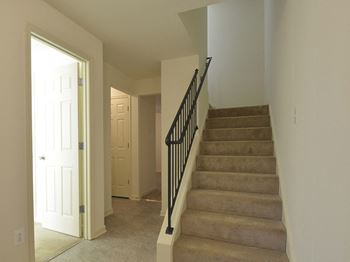 View from the bottom of the stairs looking into the hallway