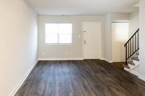 Randallstown apartment for rent - Bedroom with hardwood floors and white walls at McDonogh Village Apartments & Townhomes, Randallstown, 21133