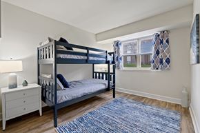 Abingdon apartment for rent - A bedroom with a bunk bed and a dresser at Woodsdale Apartments in Abingdon, MD