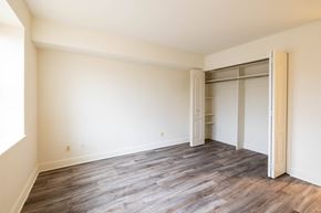 Towson apartment for rent - a bedroom with hardwood flooring and white walls  at Charlesgate Apartments, Maryland, 21204