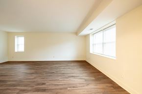 Towson apartment for rent - a bedroom with hardwood flooring and two windows  at Charlesgate Apartments, Towson, 21204